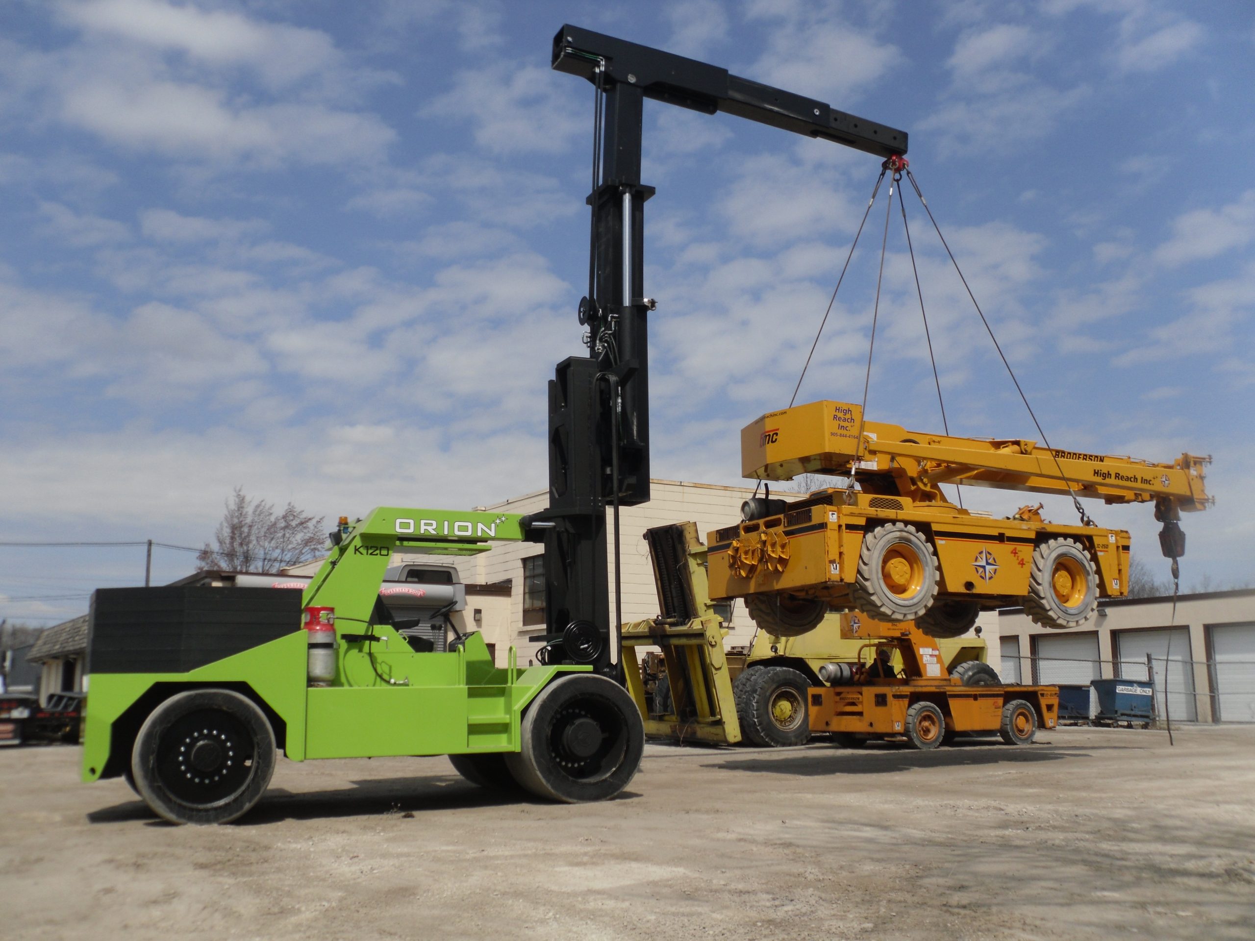 ORION 120K high-capacity forklift lifting heavy equipment during emergency production response